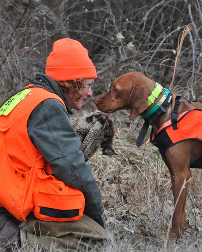 A very sweet moment. Monte retrieves a pheasant to proud Mama Janice.