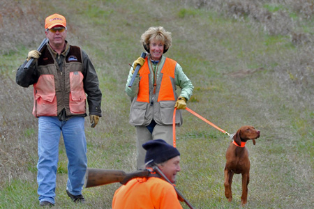 All smiles! Judy and Suede coming out of the field after a successful callback in Master Hunter