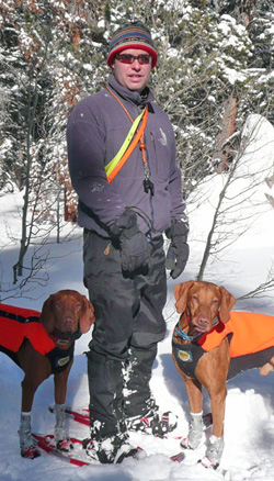 Aaron with Vizslas Kosmo and Remus snowshoeing in Colorado