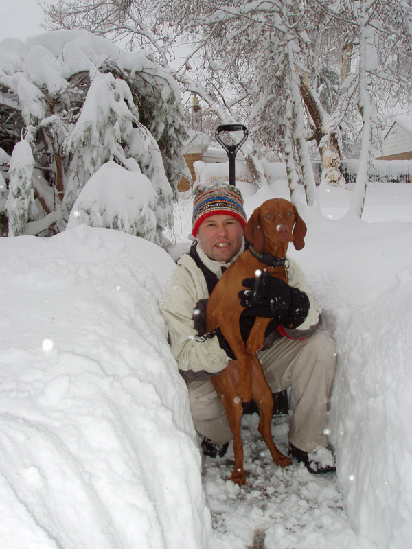 Aaron with puppy Vizsla Kosmo in a Colorado blizzard